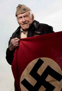 Louis Zamperini with the Nazi flag he liberated after running in the 1936 Olympics in Berlin.