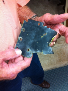 The shrapnel-ridden piece of Bob's wing that he's held on to since 1945.
