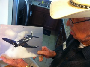 Al Rasmussen pointing out an F4U Corsair. Al's duties at Northrop Aircraft included work on the Corsair's wings.