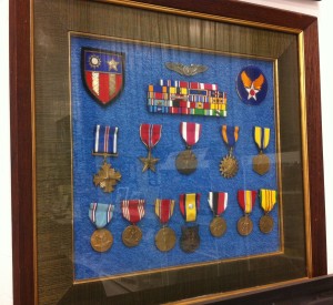 Bill's medals on display at the Warhawk Air Museum. They include the Distinguished Flying Cross, Air Medal, and Bronze Star.
