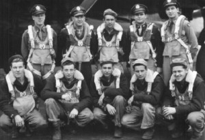Eugene Mould (standing, second from right) as a 21-year-old bomber pilot leading a crew of a ten.