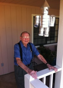 Fred with a tin woodsman he fashioned out of everyday materials.