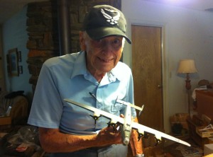 Bob Austin with a model of a B-24 like the ones he flew during World War II. For more photos, visit the Hometown Heroes facebook page.