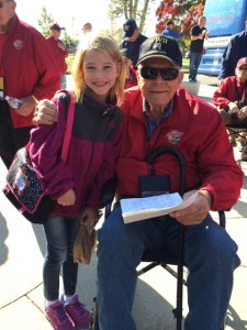 Jim with a young girl who handed him a letter of thanks at the National World War II Memorial.