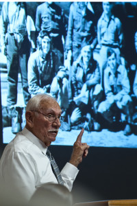 Ex-POW Dean Whitaker speaks at Nellis Air Force Base in 2013. (U.S. Air Force photo/Senior Airman Brett Clashman)