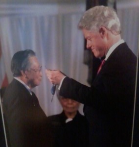 President Bill Clinton hangs the Medal of Honor around Joe's neck in 2000.