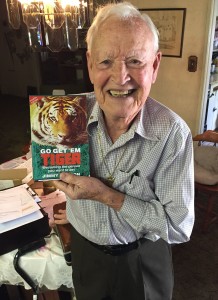 Jimmy Weldon with his book, Go Get 'Em Tiger.