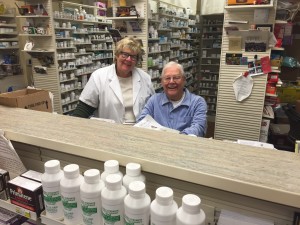 Mert with his daughter, Lynn Taylor, at Bullard Pharmacy in Fresno, CA, where Mert continues to put his pharmacist's license to work.