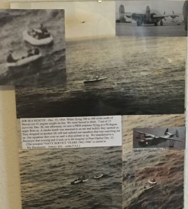 Scenes from Asbury's 1944 rescue adorn his wall in Albuquerque.